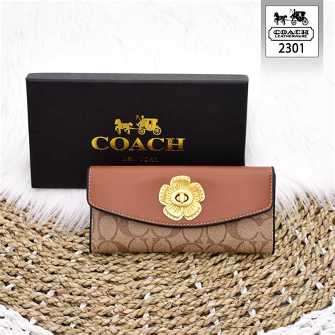 dompet coach baru.